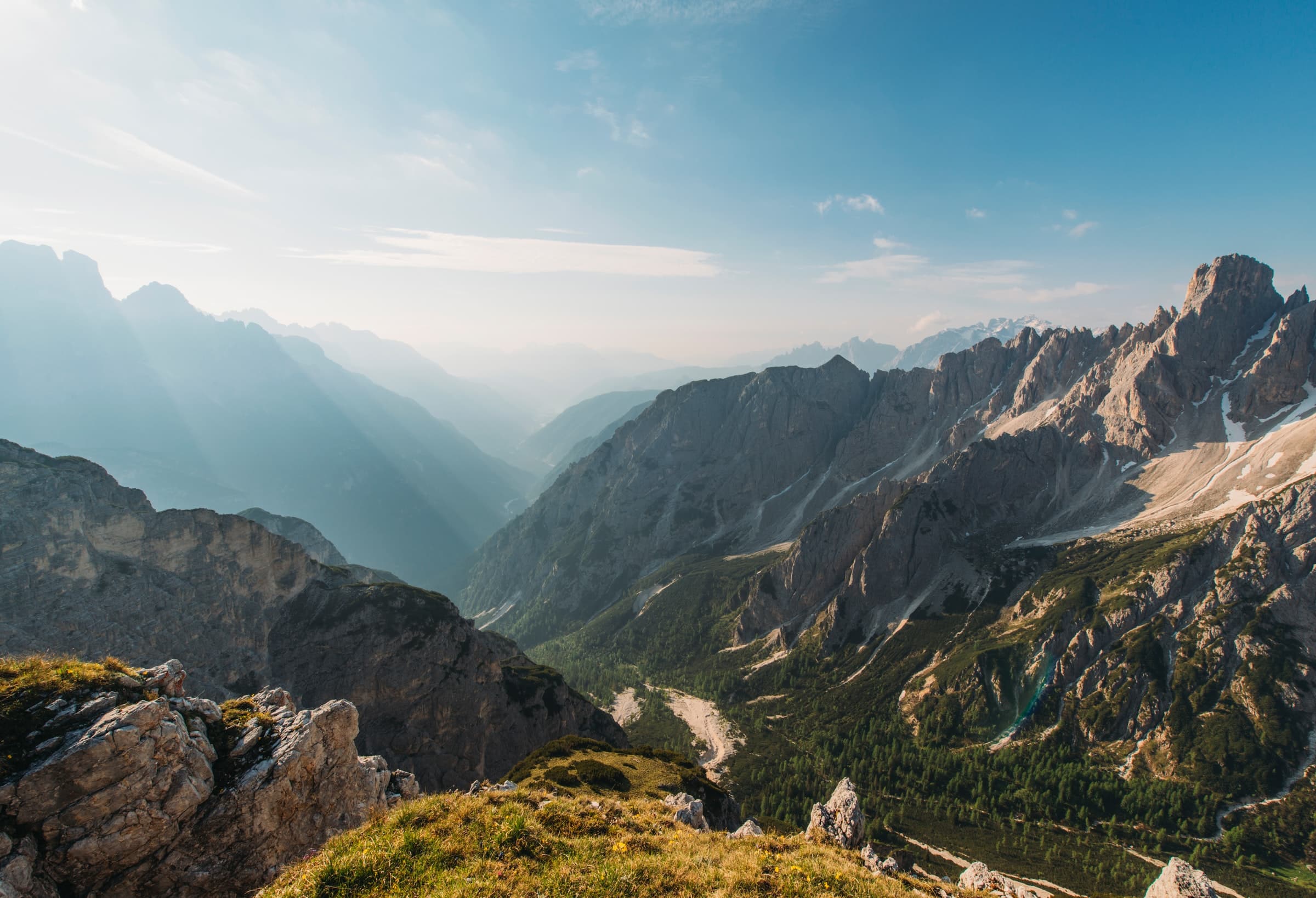 Soaring mountains under a blue sky